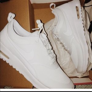 White Nike Thea Sneakers